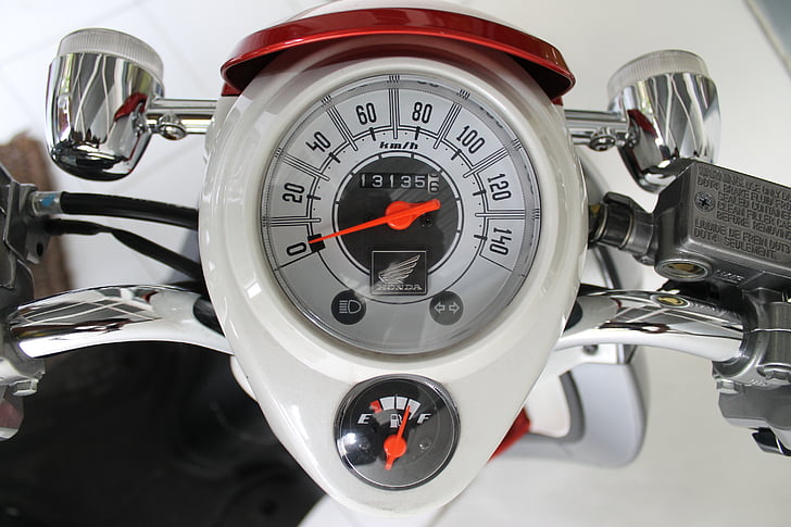 white and gray speedometer reading at 0