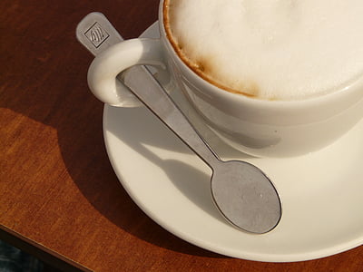 white ceramic mug on saucer