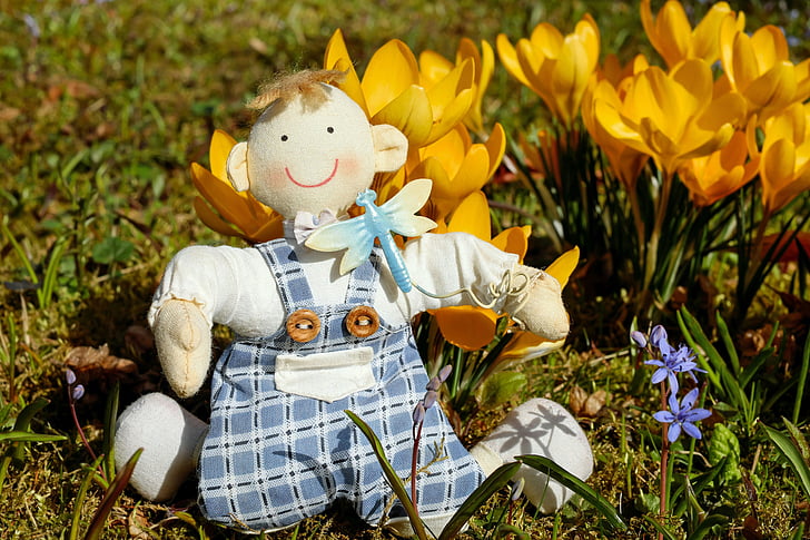 doll with yellow flowers