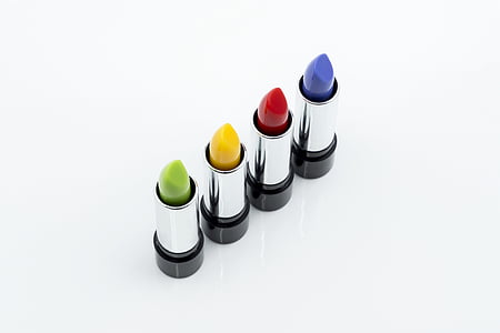 macro shot of four lipsticks bottle