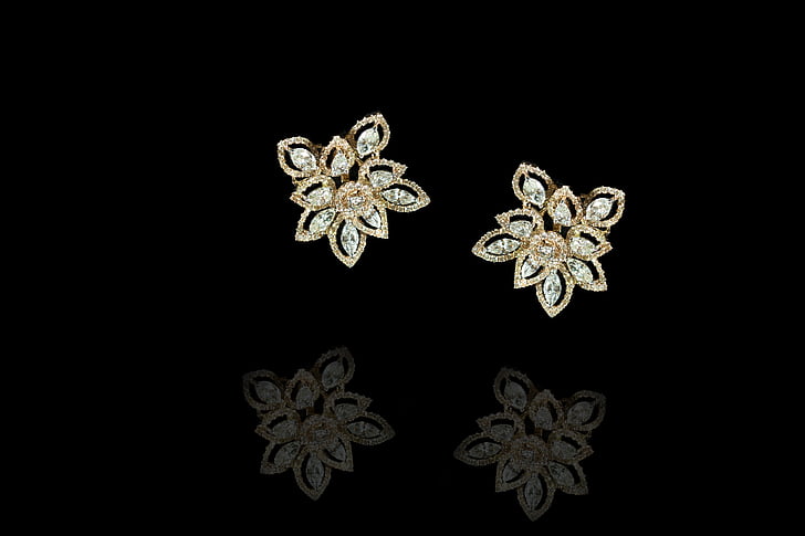 pair of gold-colored floral stud earrings