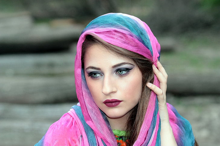 selective focus photography of woman wearing pink and blue hijab veil