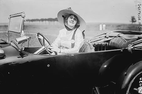 grayscale photography of woman riding convertible
