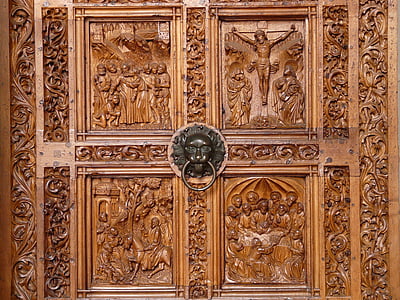 brown wooden door with gray door knocker