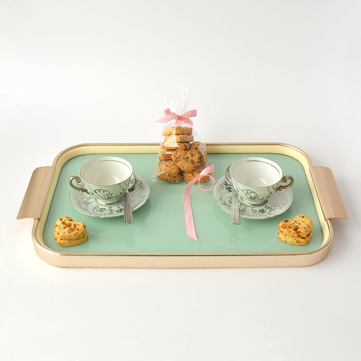 cookies and two teacups on tray