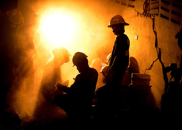 silhouette photo of miners