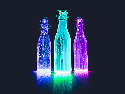 three fairy light bottle lamps