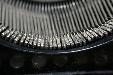 gray stainless steel typewriter part