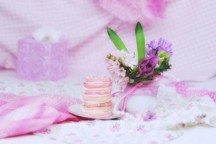 white and purple petaled flowers and round macaroons