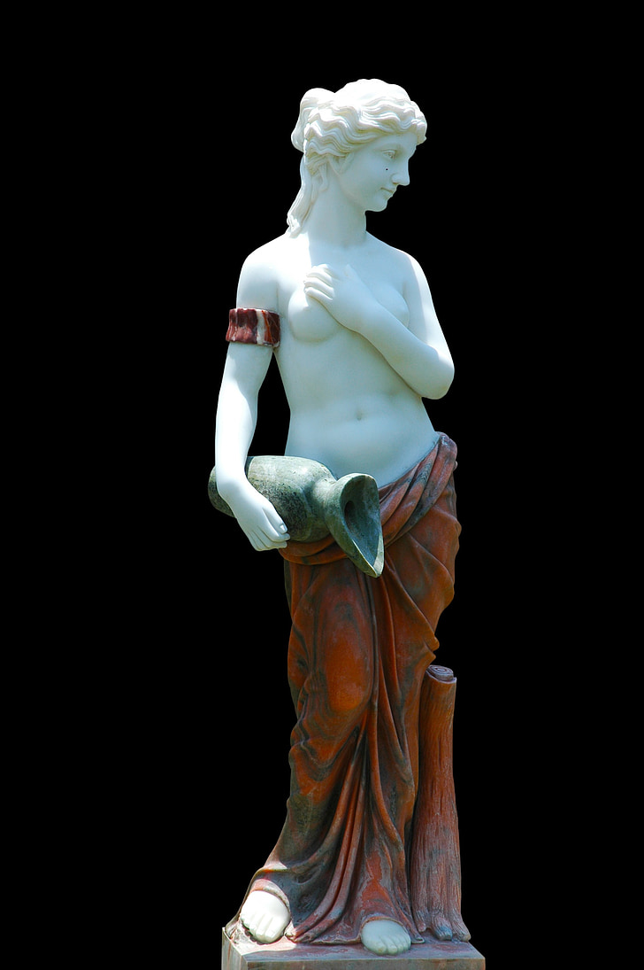 woman in red skirt holding jar with right hand and breast with left hand statue