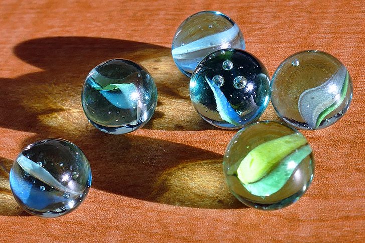 close-up photo of six marble balls