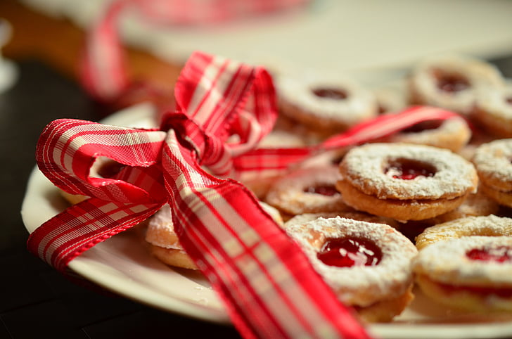 cookies with strawberry jam on white ceramic plate