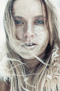 woman's face covered with white dust