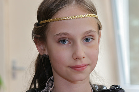 woman wearing gold-colored circlet