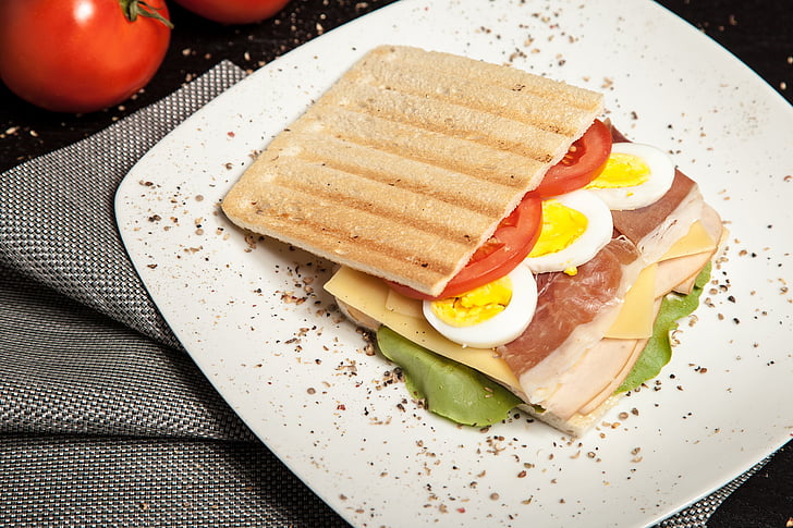 toasted bread with sliced tomato and egg