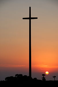 silhouette of cross during golden hour