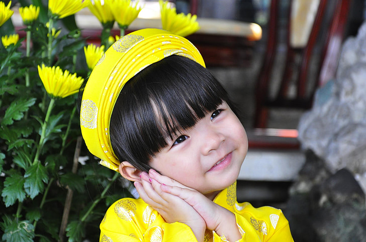 girl wearing yellow top