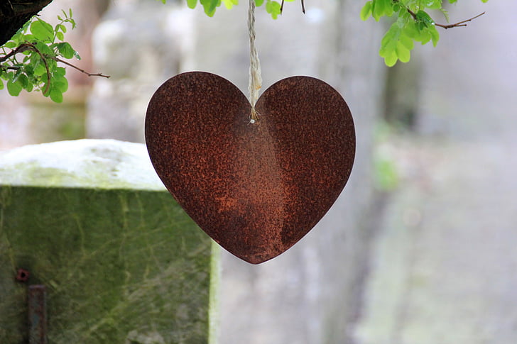 selective focus photography of red heart hanging decor