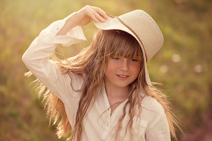 girl wearing beige hat