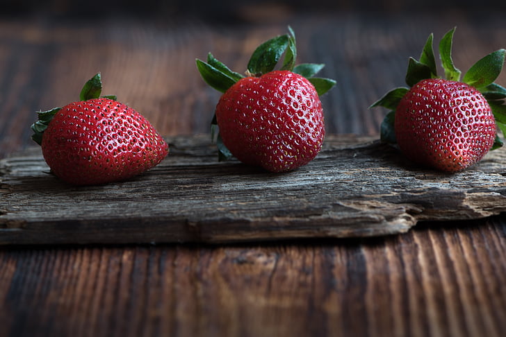 three red strawberries