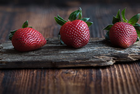 three red strawberries