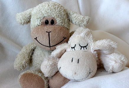 closeup photo of white sheep plush toys