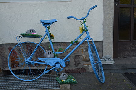 blue cruiser bicycle parked on street