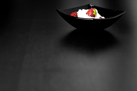 black ceramic bowl on top of black surface