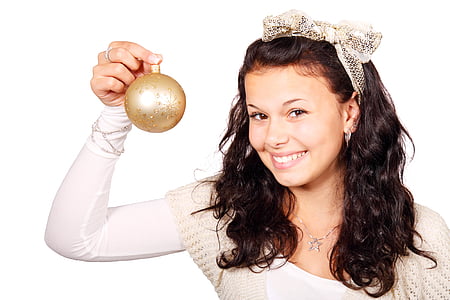 woman holding gold bauble
