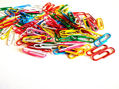 assorted-color paper clip lot on table