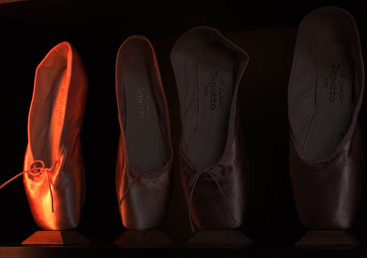 four assorted-color ballet shoes