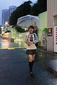 woman smiling holding umbrella