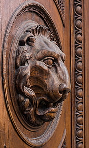 brown wooden carved lion figure