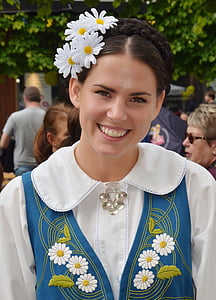 woman wearing white top smiling