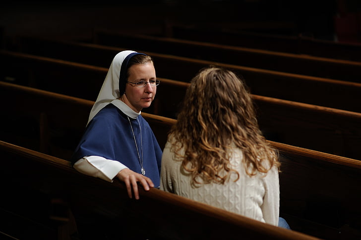 woman talking to a nun