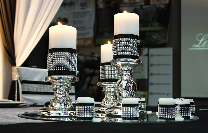 black-and-silver candlesticks and tealight candle holders