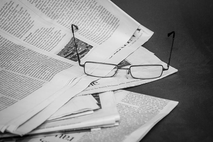 eyeglasses on newspaper