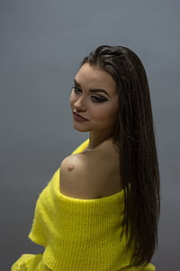 woman wearing yellow off-shoulder top