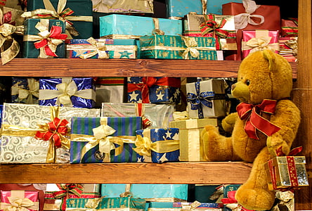 brown bear plush toy on brown shelf
