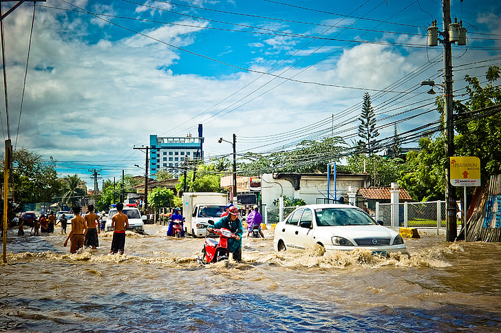 suburban street submerge in water during daytime