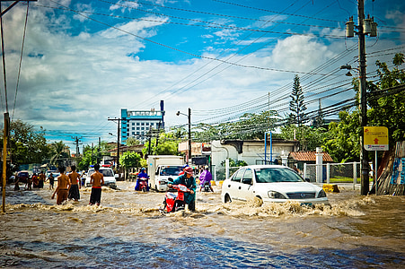 suburban street submerge in water during daytime