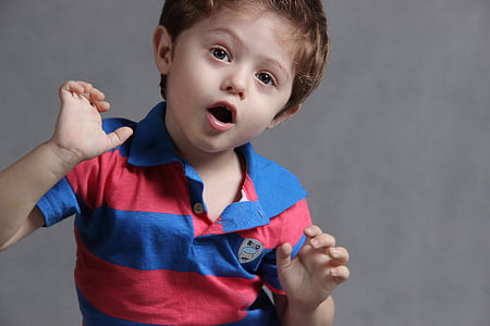 toddler boy wearing red and blue striped polo shirt