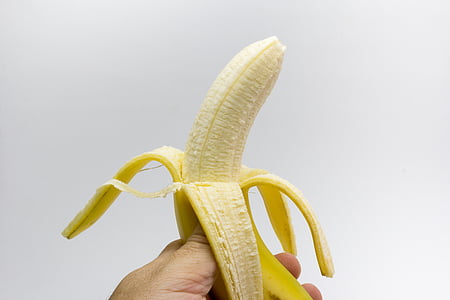 person holding peeled banana