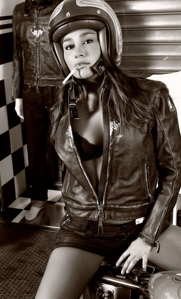 grayscale photo of woman wearing black leather jacket