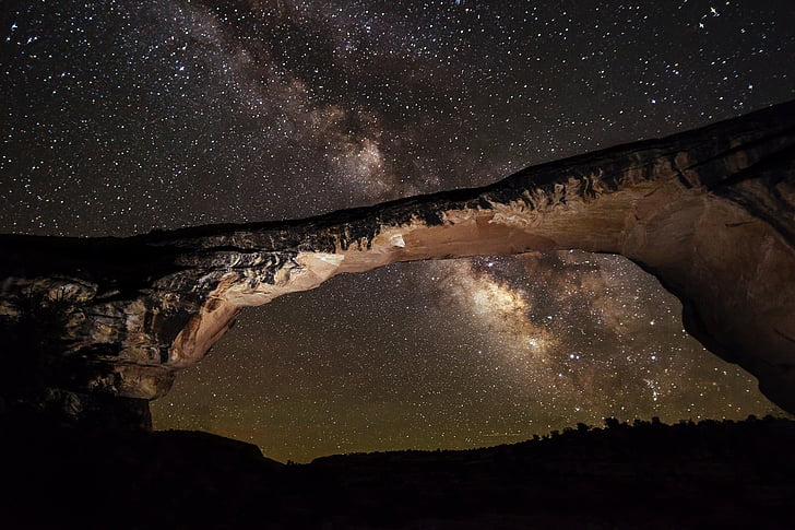 rock formation over starry sky