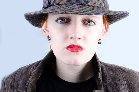 portrait photo of woman in gray hat