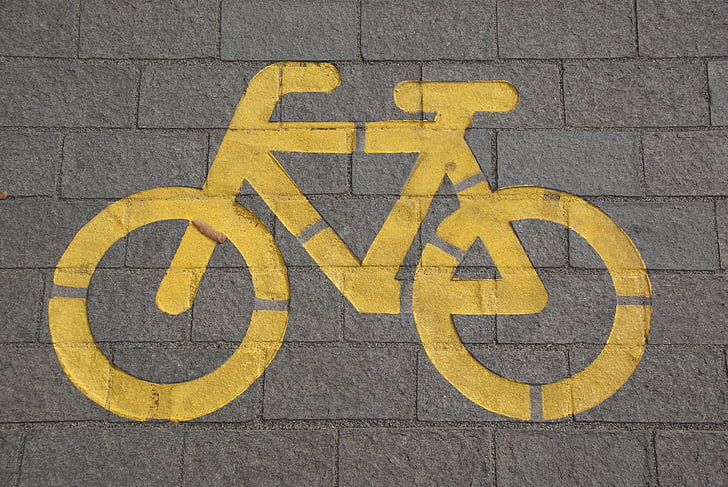 yellow bicycle lane signage