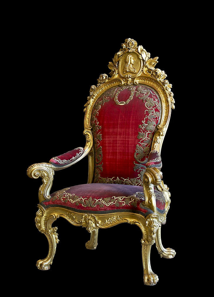 gold-colored frame red floral padded armchair