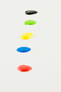 five red, blue, yellow, green, and black paint drops