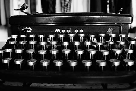 grayscale photography of typewriter